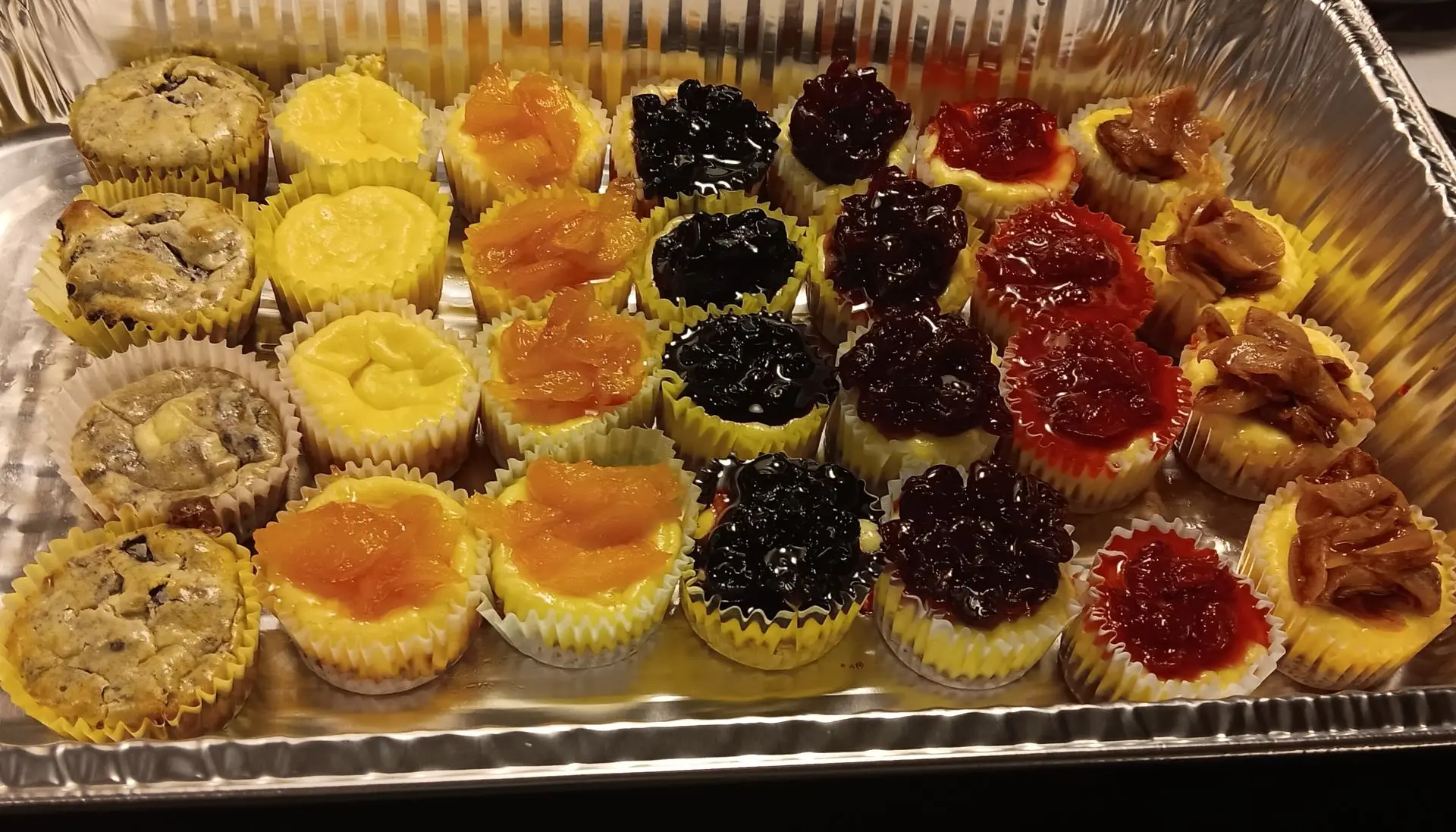 mini cheese cake assorted variety with homemade fruit toppings 